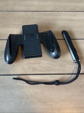 244. Nintendo Black Joy-Con Grip with Matching Wrist Strap